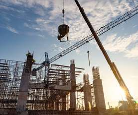 Construction site with cranes and building framework