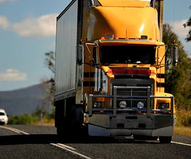 Yellow truck driving on an Australian road