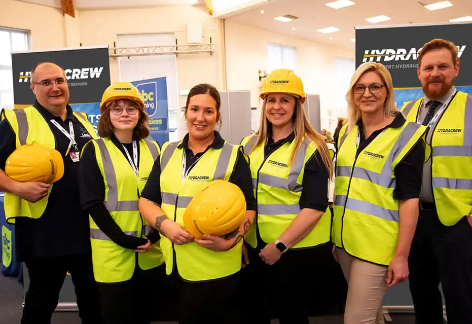 HydraCrew team in high-vis vests and hard hats.